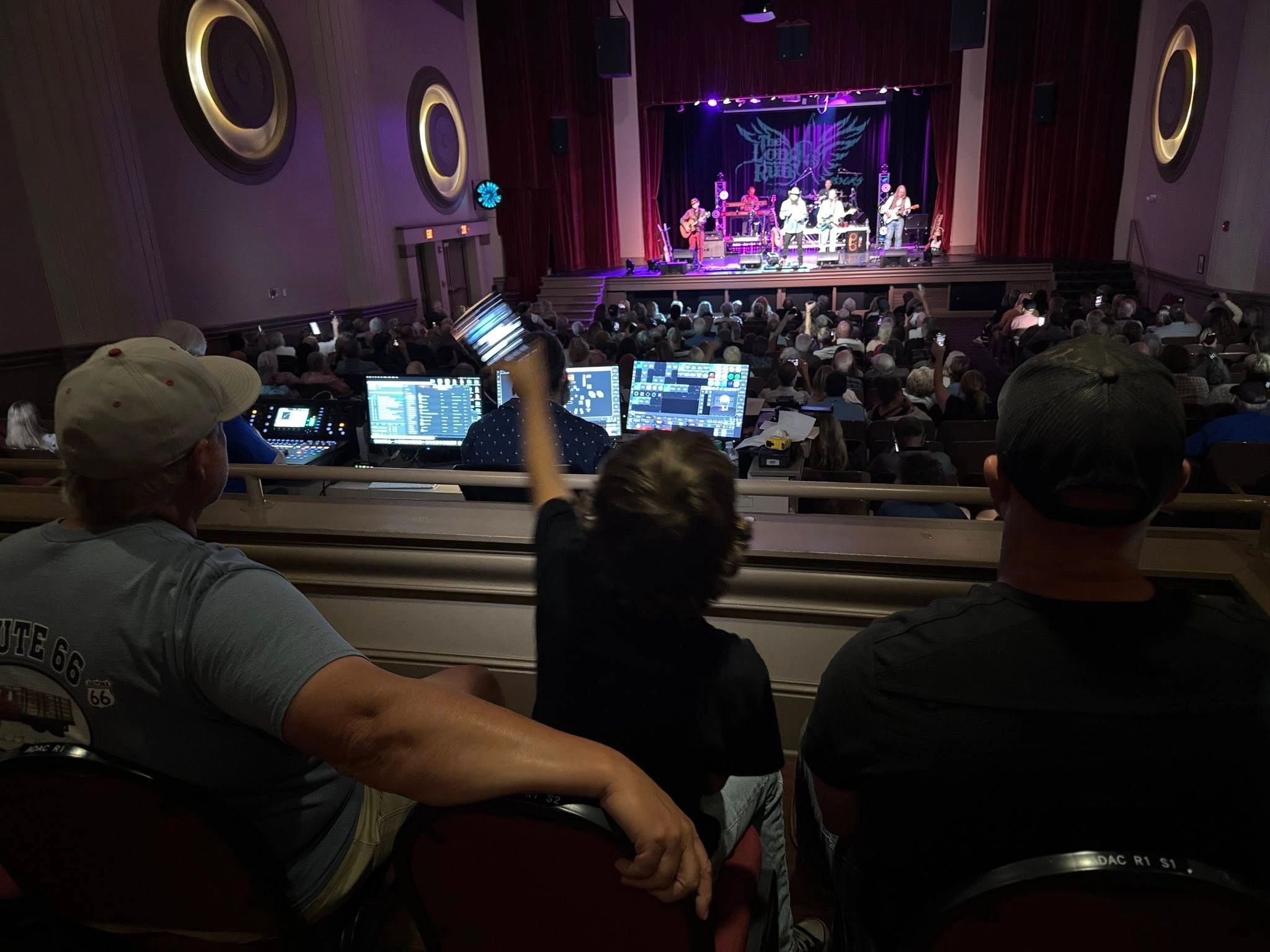 Concert audience with stage lighting