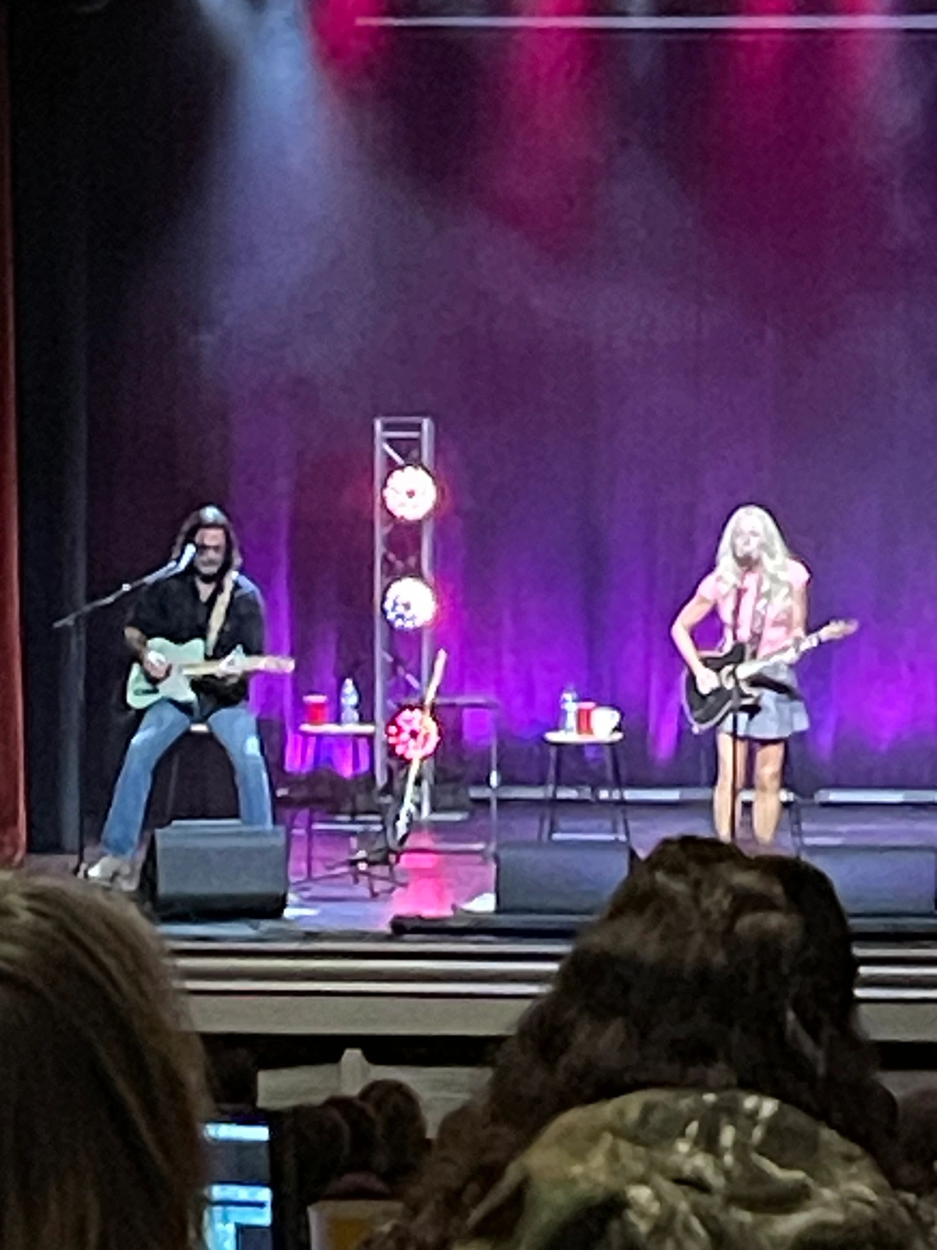 Concert performance with purple backdrop